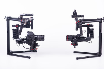 Systems stabilization video camera and lens on steady equipment support such as gimbal steady or stabilized. White background.