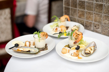 Seafood sets at local restaurant, fine dining, Fresh seafood platter with , mussels and on plate with tartar sauce
