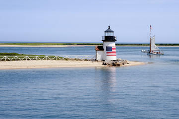 Sailing Past Lighthouse on Nantucket Island on a Summer Day