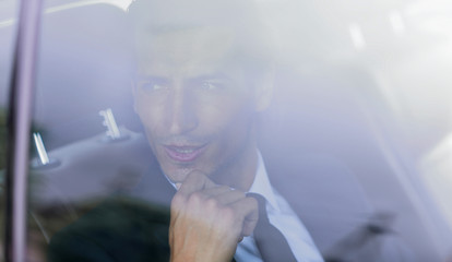 background image of the businessman in the car