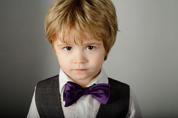 Fashion for children. Fashionable little boy in stylish clothes&bow tie. Toddler child with brown...