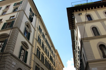 Fototapeta na wymiar Tops of Florentine buildings in the streets of Florence, Italy
