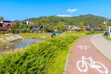 Cycling lane along Grajcarek river and promenade in Szczawnica town, Pieniny Mountains, Poland