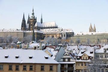 Fototapeta premium Christmas Snowy Prague City with gothic Castle, Czech republic