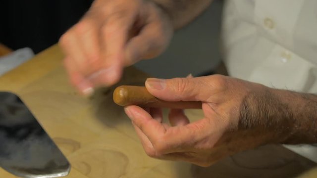Creating and hand rolling cigar 2