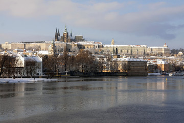Fototapeta na wymiar Christmas Snowy Prague City with gothic Castle, Czech republic