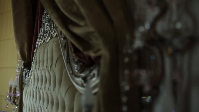 Vintage bed in a beautiful room with sunlight in blur