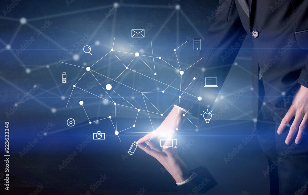 Poster male hands touching interactive table with blue mixed communication icons in the background