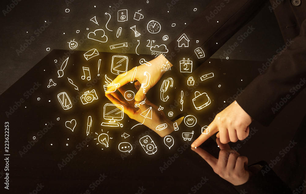 Poster male hands touching interactive table with yellow mixed media icons on it
