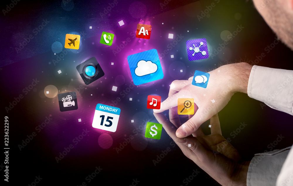 Poster Male hands touching interactive table with colorful application icons on it 