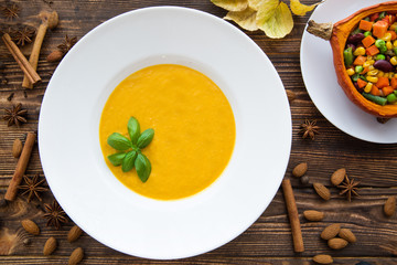 Tasty pumpkin cream soup, blended with spice and onion, stuffed pumpkin with vegetables, carrots, beans, sweet corns and haricot, cinnamon, anise and pepper.