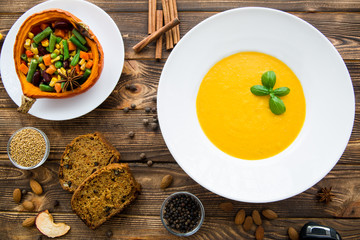 Tasty pumpkin cream soup, blended with spice and onion, stuffed pumpkin with vegetables, carrots, beans, sweet corns and haricot, cinnamon, anise and pepper.