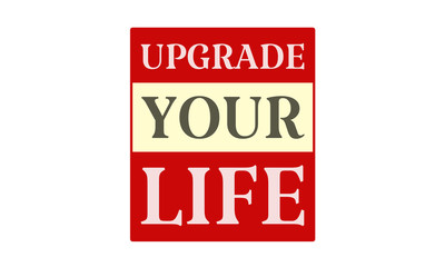 Upgrade Your Life - written on red card on white background