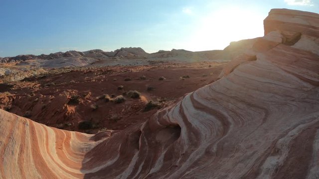 The coloful striped landscape at sunset of Fire Wave Trail at Valley of Fire State Park in Nevada, United States in Mojave desert. Fire Wave is one of the most iconic formations at Valley of Fire.