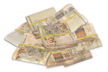 Brazilian money tied and piled