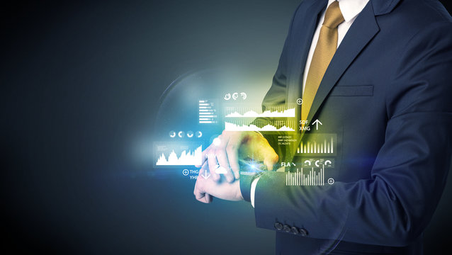 Businessman wearing smartwatch with graphics and charts on it.