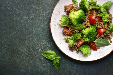 Buckwheat detox salad with broccoli and tomato.Top view with copy space.