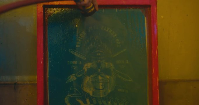 Silk screen printing process - cleaning a screen with water. 4K UHD