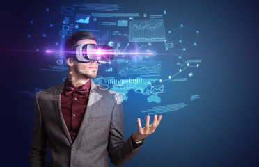 Amazed businessman with virtual reality business plan in front of him 