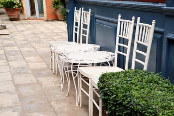 white chair in front of coffee shop