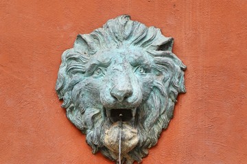 Lion statue spitting water