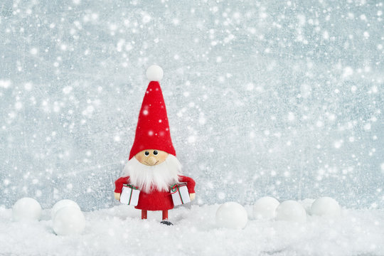 Christmas greeting card. Santa gnome background with Christmas tree and snow.