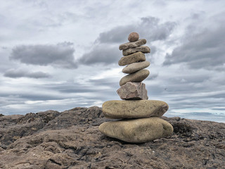 Stacked rocks on a rock at the beach, Buckie, Scotland
