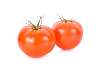 whole fresh tomato on white background