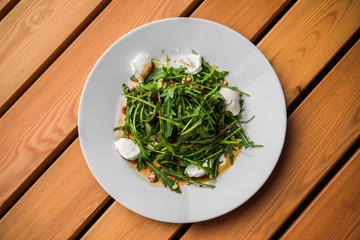 Green salad with arugula, beets and cottage cheese