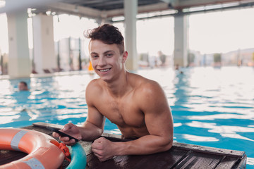 Young and fit man at the pool