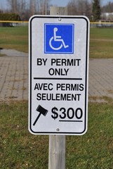 By permit only sign posted in parking area