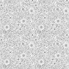 Seamless floral doodle background pattern in vector.