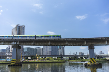 view of monorail above shibaura canal tokyo