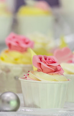 Sweet topping wedding cake decoration./ Sweet beauty flower and topping pastel color on homemade wedding cake decoration.