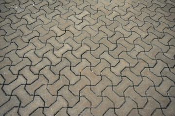 patterned paving tiles with cement brick floor background