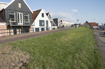 Fototapeta na wymiar Dike-houses along the harbor