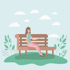beautiful woman sitting on park chair
