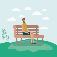 young man sitting on park chair