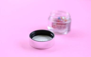 Woman beauty makeup closeup on pink texture blur background