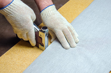 Mount new cloth to chipboard stapler on staples