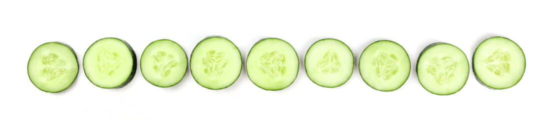 Cucumber slices forming a line on a white background with a place for text
