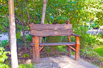 Original empty wooden bench in the park. Summer
