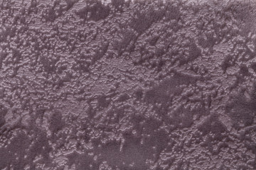 Brown background from a soft upholstery textile material, closeup.