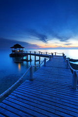 Wood jetty in the beach at the sunset, Koh Kood at Trat of Thailand