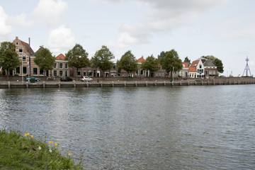 Fototapeta na wymiar East harbor (Oosterhaven) is the entrance to Medemblik from the IJsselmeer