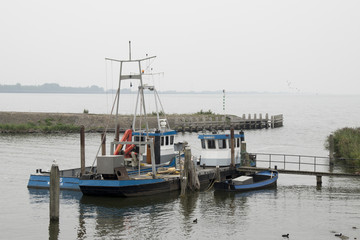 Fototapeta premium Fishing boat mooring in the harbor