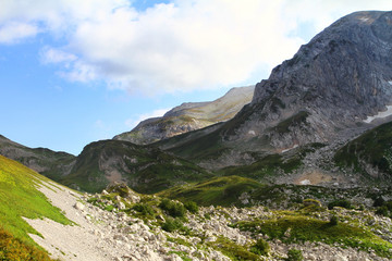 Fototapeta na wymiar natural landscape photo of cute mountain passage landscape with light blue sky