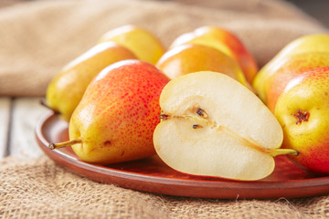Ripe pears on rustic wooden table