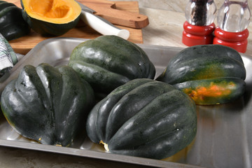 Acorn squash in a baking pan