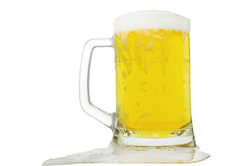 Beer is poured into glass of foam leaking against a white background